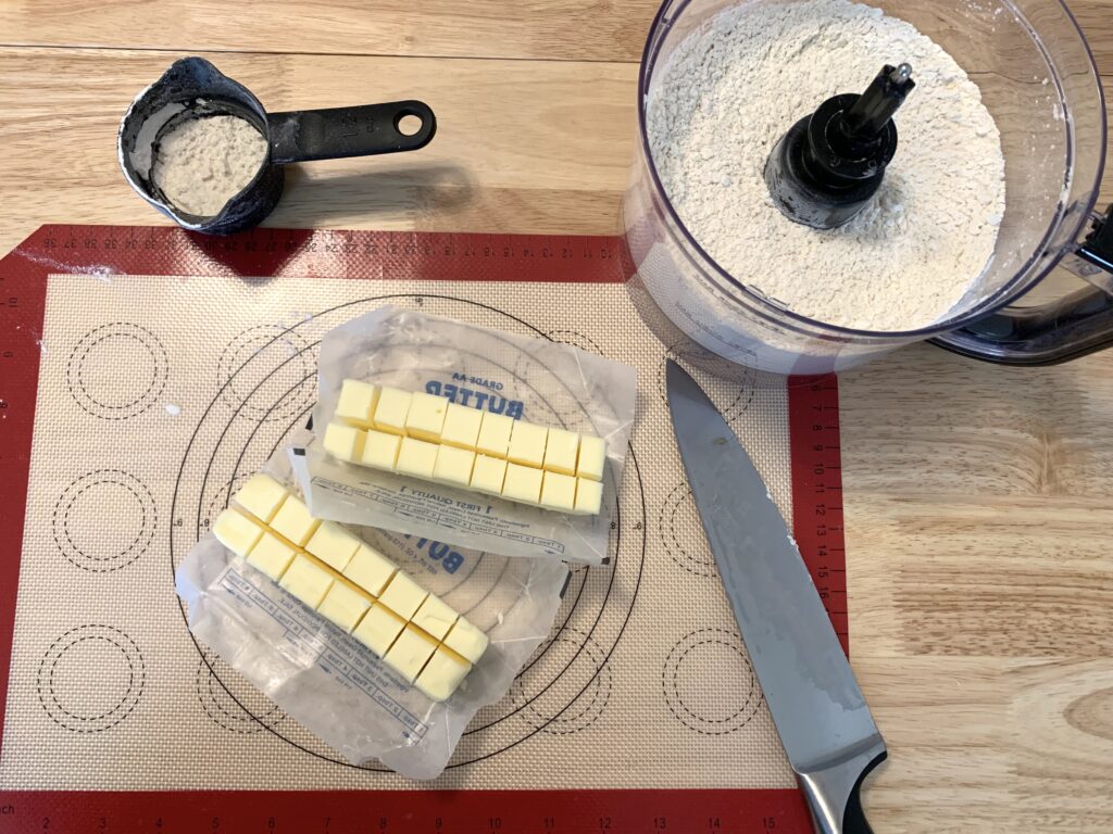 Cubed butter sitting on a silicon mat